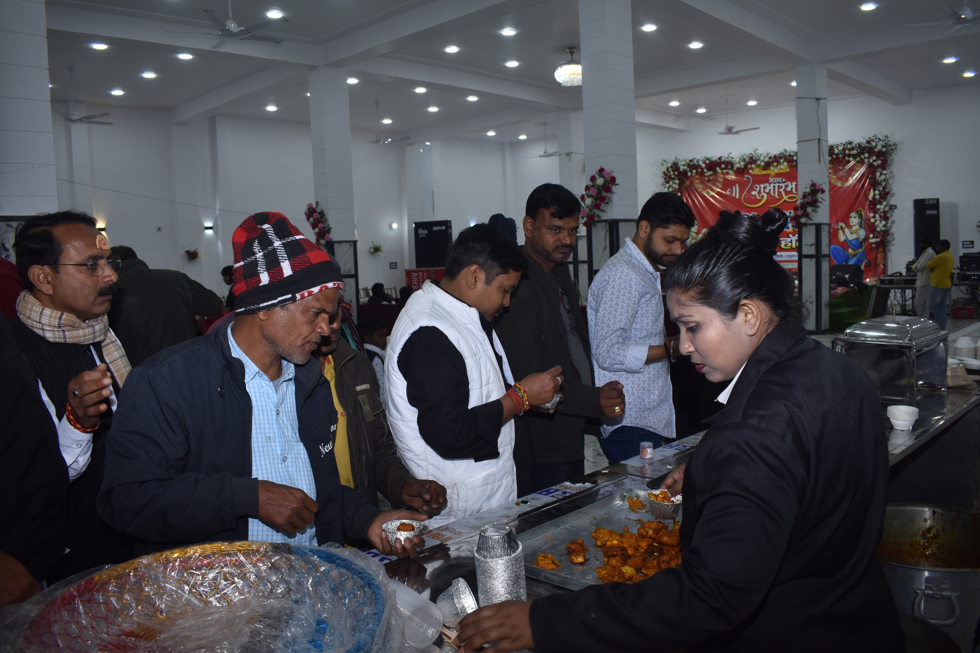 Guests being served hot snacks at the buffet